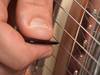 How to play pinch harmonics
